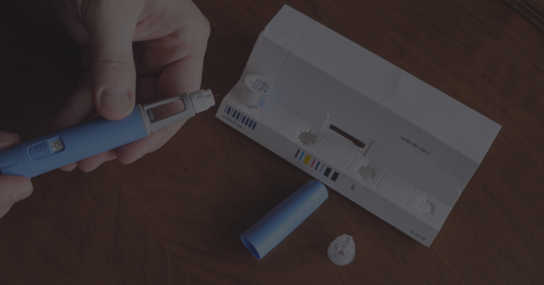 Someone looking at an injectable medication